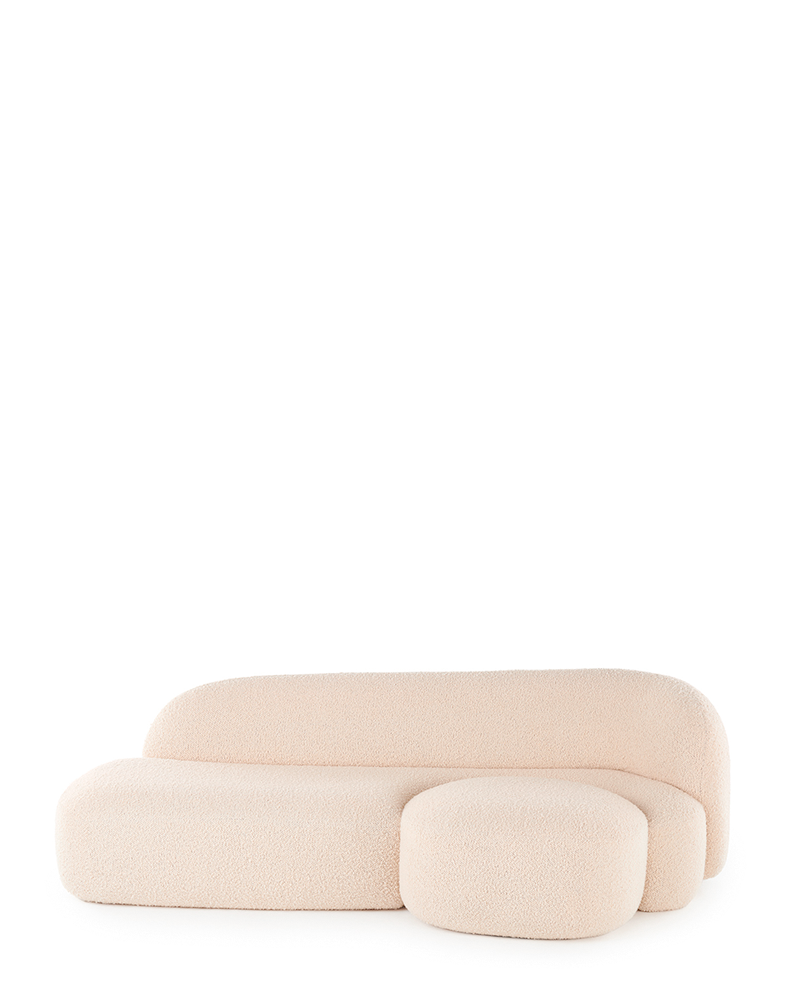 A beige AALAND sofa with a soft, organic shape and a small attached seat, designed by Patricia Urquiola.
Fabric upholstered polyurethane