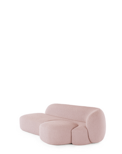 A pink AALAND sofa with a soft, organic shape and a small attached seat, designed by Patricia Urquiola.
Fabric upholstered polyurethane
