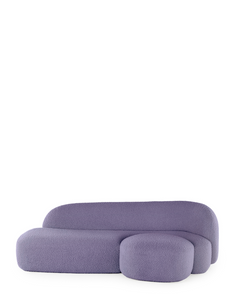 A purple AALAND sofa with a soft, organic shape and a small attached seat, designed by Patricia Urquiola.
Fabric upholstered polyurethane