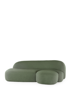 A green AALAND sofa with a soft, organic shape and a small attached seat, designed by Patricia Urquiola.
Fabric upholstered polyurethane