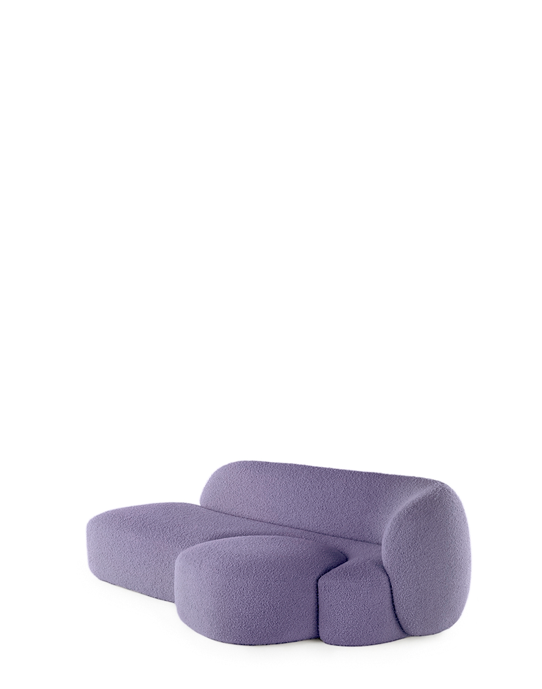 A purple AALAND sofa with a soft, organic shape and a small attached seat, designed by Patricia Urquiola.
Fabric upholstered polyurethane
