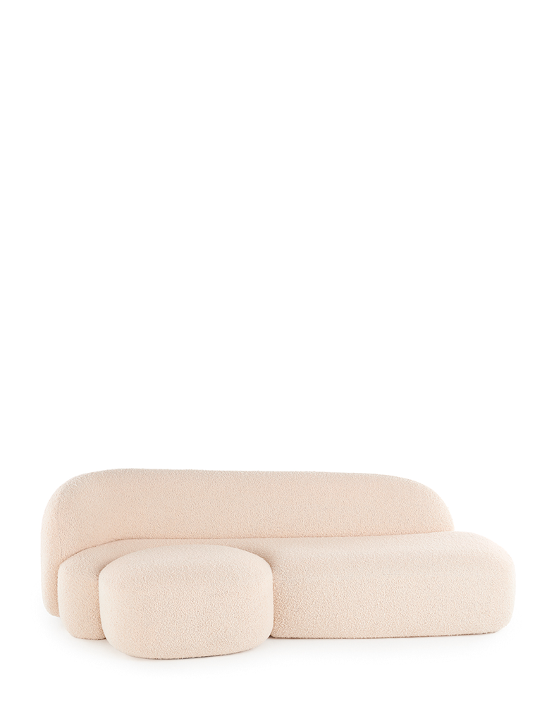 A beige AALAND sofa with a soft, organic shape and a small attached seat, designed by Patricia Urquiola.
Fabric upholstered polyurethane