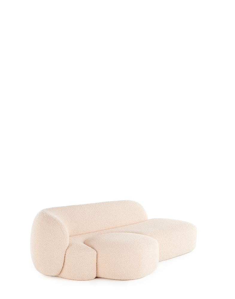 A beige AALAND sofa with a soft, organic shape and a small attached seat, designed by Patricia Urquiola.
Fabric upholstered polyurethane