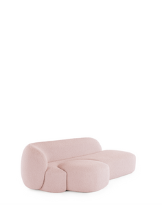 A pink AALAND sofa with a soft, organic shape and a small attached seat, designed by Patricia Urquiola.
Fabric upholstered polyurethane