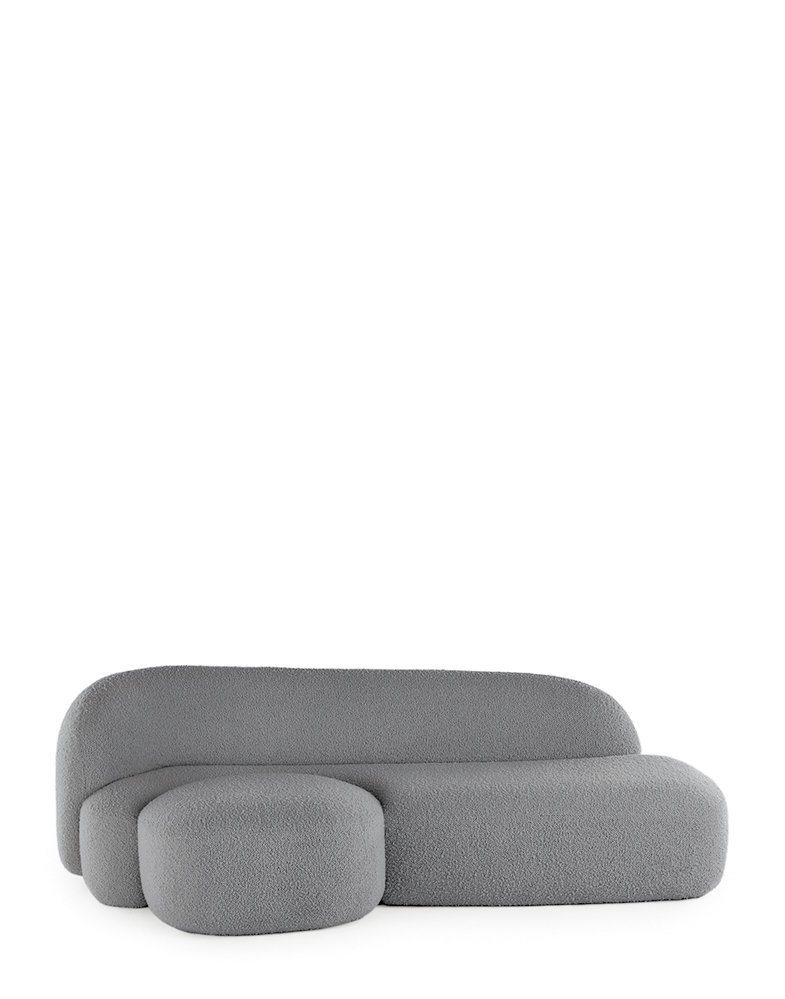A grey AALAND sofa with a soft, organic shape and a small attached seat, designed by Patricia Urquiola.
Fabric upholstered polyurethane