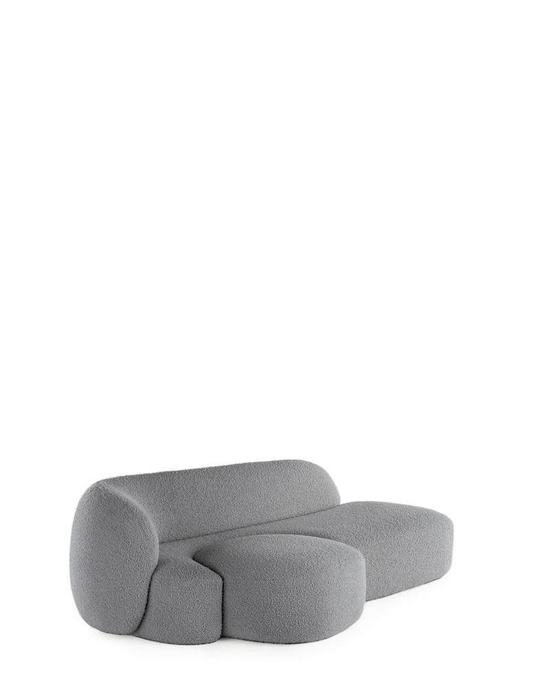 A grey AALAND sofa with a soft, organic shape and a small attached seat, designed by Patricia Urquiola.
Fabric upholstered polyurethane