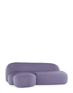 A purple AALAND sofa with a soft, organic shape and a small attached seat, designed by Patricia Urquiola.
Fabric upholstered polyurethane