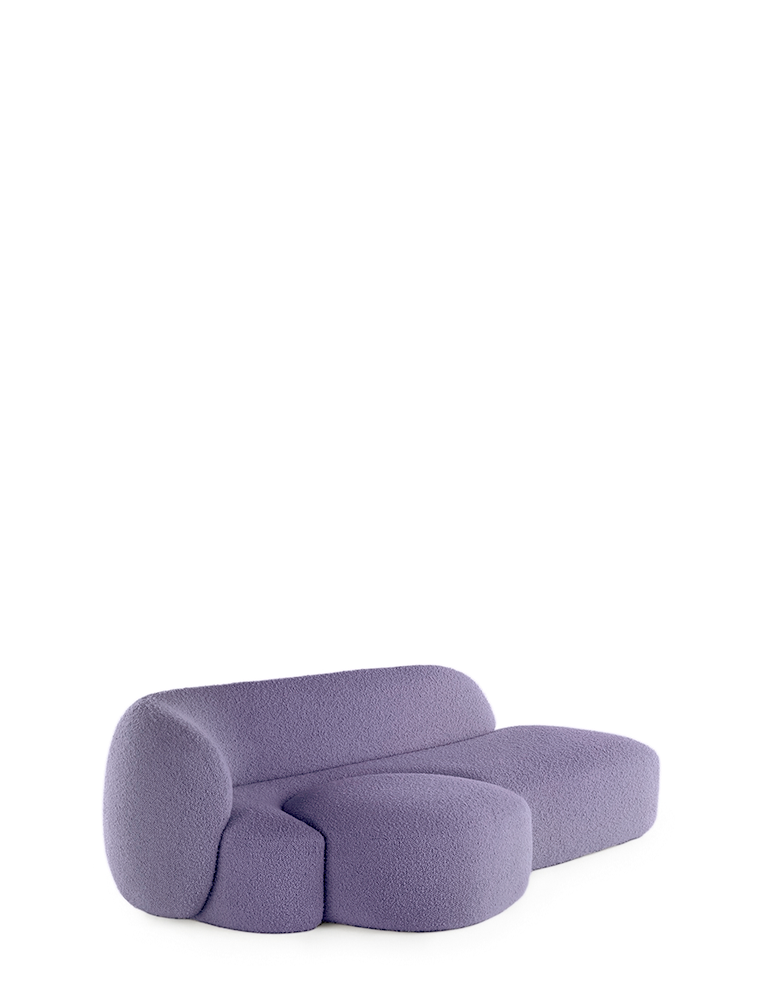 A purple AALAND sofa with a soft, organic shape and a small attached seat, designed by Patricia Urquiola.
Fabric upholstered polyurethane