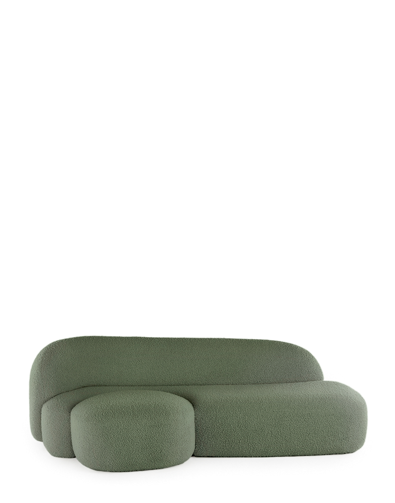 A green AALAND sofa with a soft, organic shape and a small attached seat, designed by Patricia Urquiola.
Fabric upholstered polyurethane
