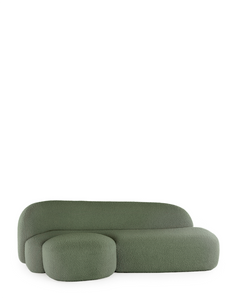 A green AALAND sofa with a soft, organic shape and a small attached seat, designed by Patricia Urquiola.
Fabric upholstered polyurethane