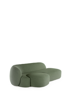 A green AALAND sofa with a soft, organic shape and a small attached seat, designed by Patricia Urquiola.
Fabric upholstered polyurethane